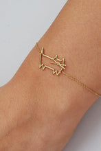 Load image into Gallery viewer, Gold chain bracelet with cat shaped pendant worn by model
