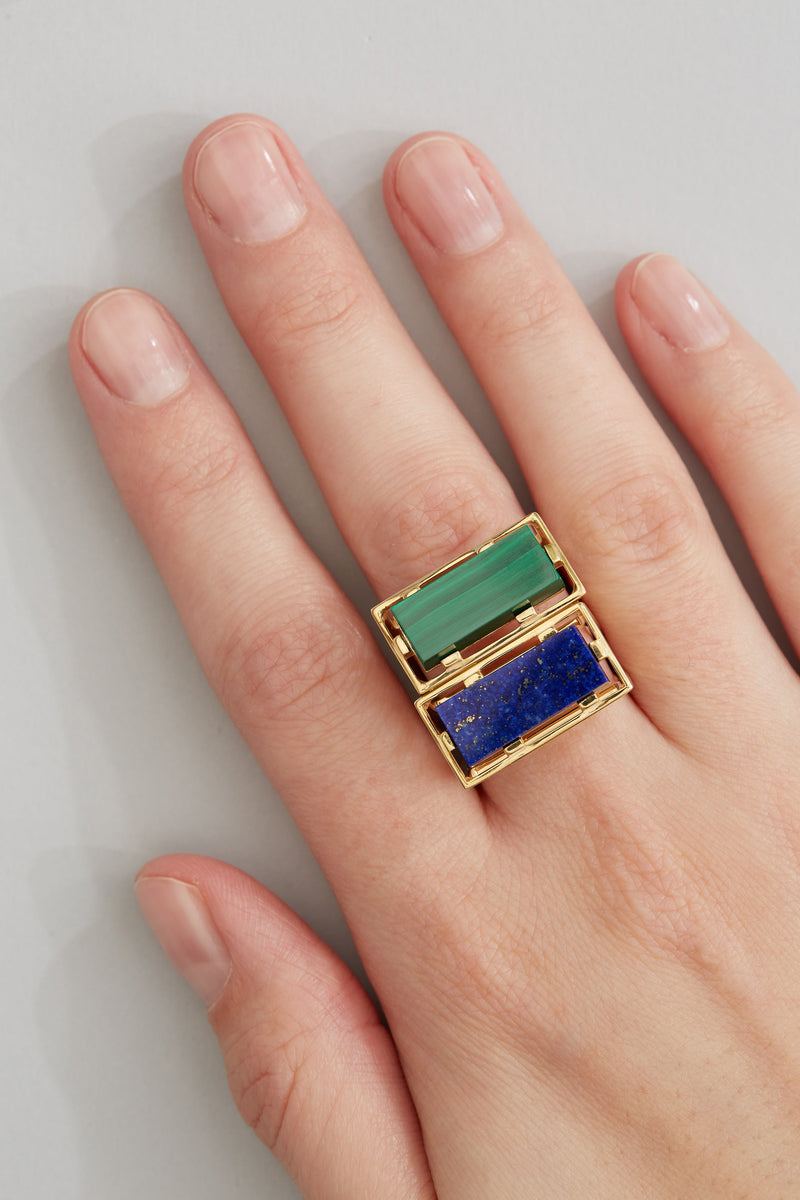 Gold square rings with lapis lazuli and malachite stones worn by model