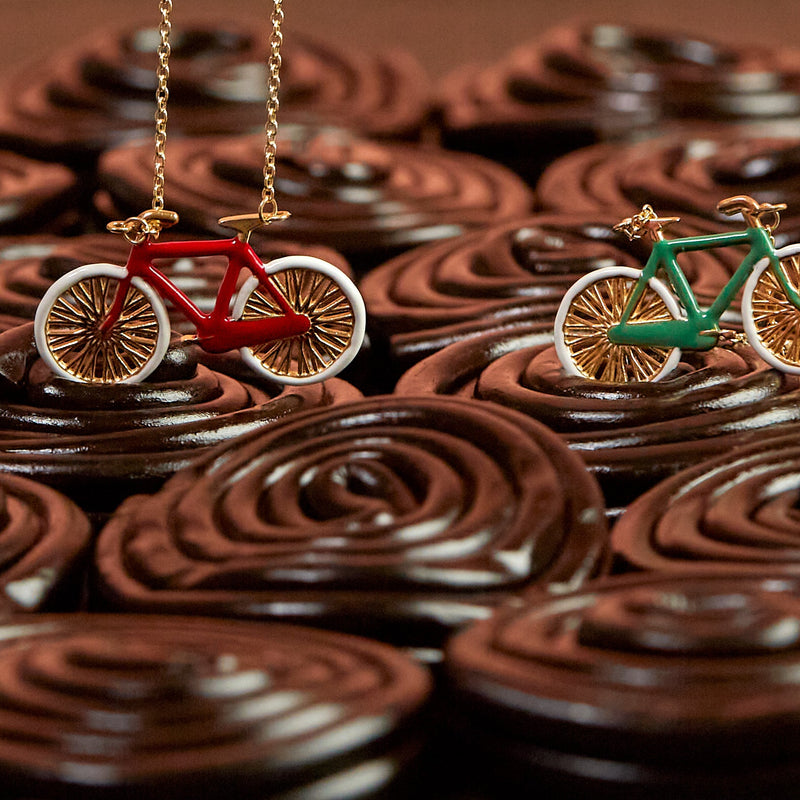 Licorice with gold necklaces with bike shaped pendants