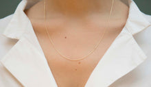 Load image into Gallery viewer, Yellow gold chain necklace with ring clasp worn by model
