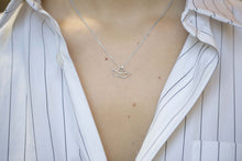Load image into Gallery viewer, White gold chain necklace with little boat shaped pendant worn by model
