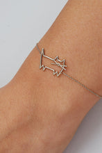 Load image into Gallery viewer, Woman wearing a white gold chain bracelet with a cat shaped pendant
