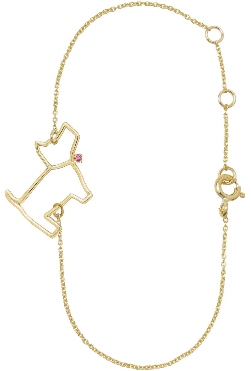 Gold chain bracelet with a little dog shaped pendant with a pink sapphire