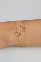 Load image into Gallery viewer, Gold chain bracelet with family shaped pendant worn by model
