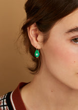 Load image into Gallery viewer, Gold earring with avocado shaped oxidized turquoise and pearl on model
