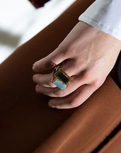 Gold square rings with jasper stone and blue jade worn by model