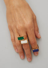 Load image into Gallery viewer, Hand wearing gold square rings with precious stones
