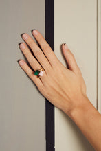 Load image into Gallery viewer, Hand wearing two gold rings with cylinder cut pink opal and malachite stones
