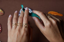 Load image into Gallery viewer, Gold rings shaped in cat, camera, shark with small diamonds on woman&#39;s hand
