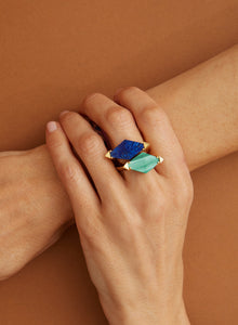 Gold rings with lapis lazuli and malachite in rhombus cut on woman's hand