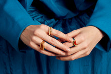 Load image into Gallery viewer, Woman wearing gold rings, with citrine stone and a watermelon slice in red coral
