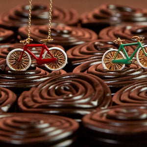 Licorice with gold necklaces with bike shaped pendants