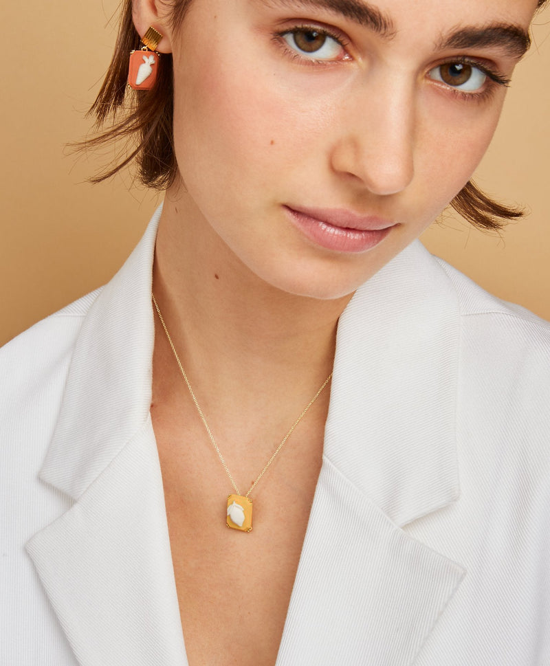 Gold chain necklace with lemon porcelain cameoworn by model