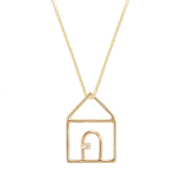 Gold chain necklace with house shaped pendant and small diamond