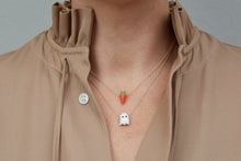 Load image into Gallery viewer, Model wearing gold chain necklaces with carrot shaped coral pendants and ghost shaped white coral pendant
