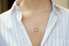 Load image into Gallery viewer, Gold chain necklace with earth shaped pedants with blue enamel worn by model

