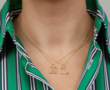 Load image into Gallery viewer, Gold necklaces with house and rabbit shaped pendants worn by model
