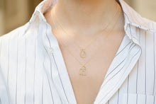 Load image into Gallery viewer, Gold chain necklaces with gold house and light bulb shaped pendants worn by model
