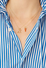 Load image into Gallery viewer, Gold chain necklaces with small rabbit  and carrot shaped pendants worn by model
