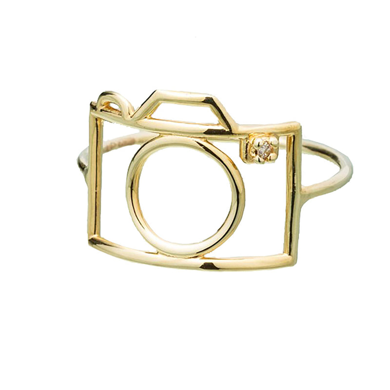 Gold camera shaped ring with small diamond
