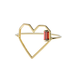 Heart shaped gold ring with small baguette cut garnet