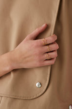 Load image into Gallery viewer, Gold perrito shaped ring worn by model

