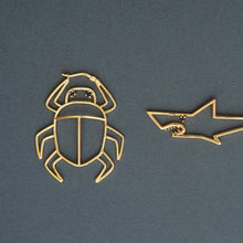 Load image into Gallery viewer, Gold scarab beetle shaped maxi earring with small blue sapphires and Shark earring
